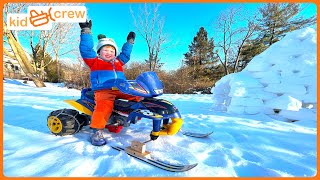 Driving Power Wheel snowmobile, awesome winter sledding track and snow igloo. Educational | Kid Crew