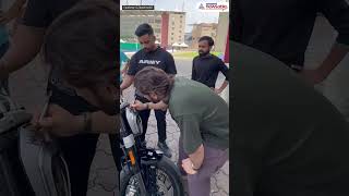 MS Dhoni Autographs Fan’s Bike: Viral Video Captures the Heartwarming Moment