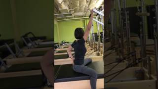 Spine stretch with push through bar