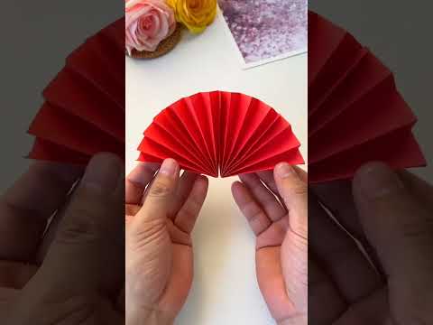 Create a mesmerizing hanging décor by crafting it from paper and adding a thread to make it spin