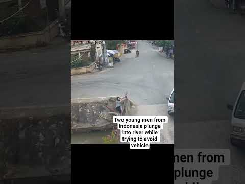 Two young men from Indonesia plunge into river while trying to avoid vehicle #reels #fyi #fypシ゚viral