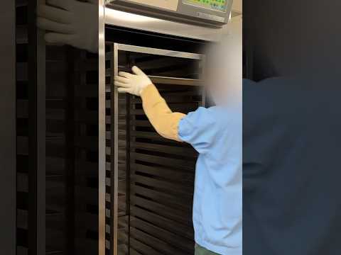 Female Inmate suits up to handle bread in Japanese Prison