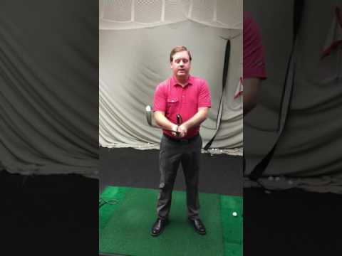 GolfTEC coach explains benefit of lead wrist flexion using theHANGER swing aid