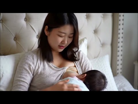 Young Mothers Breastfeeding her baby at home