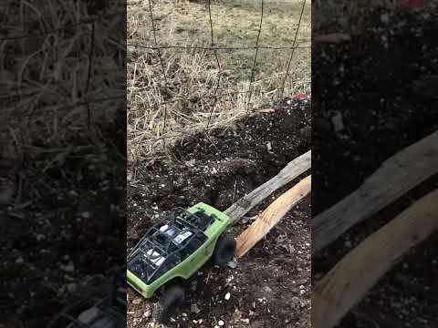 Axial SCX24 deadbolt action on outdoor dirt course