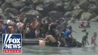 BREAKING: Migrants storm city border as national emergency requested