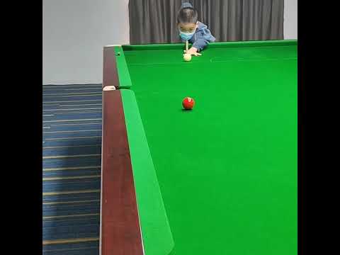 With my 8 year old student Guan Hanlin at Yushan International Billiards Academy China
