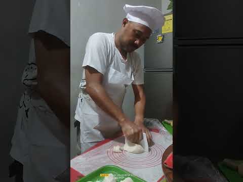 Slicing and scaling of dough to it's equal weights and sizes at 50 grams.