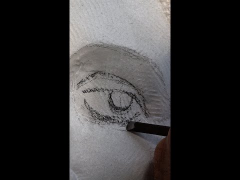 Carving an eye in stone