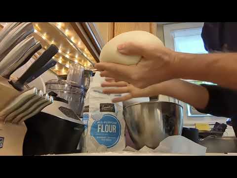 Shaping a loaf of sourdough