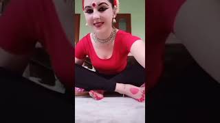 Odissi dance performance preparation - coloring fingers and feet with alta