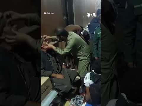 Medics treat injured passengers rescued from a hijacked train in Pakistan’s Balochistan province