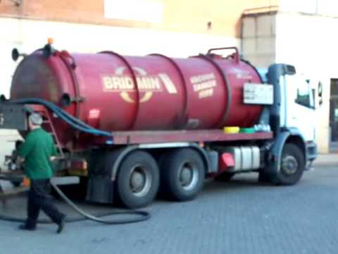 Vacuum Tanker Collecting Used Oil At KFC