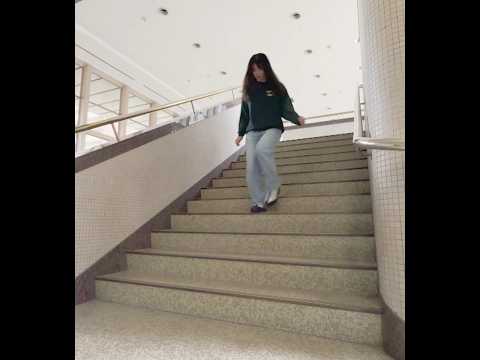Girl rushing down the stairs