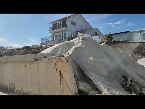 Houses falling into the ocean after hurricane comes through Daytona Beach.  Sea walls are a must!