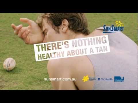 Dark Side of Tanning - boy playing footy