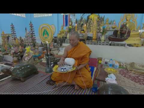 Final blessing moment for Father of Muay Thai Nai KhanomTom amulets. หลวงพ่ออาจ ปลุกเสก (2)