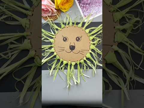 Let's create a striking lion face using a circular cardboard canvas!