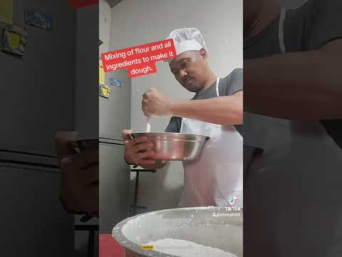 Mixing all ingredients for making the dough for empanadas.