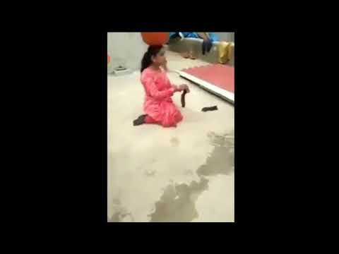 Inspirational viral video of handicapped lady carrying water.