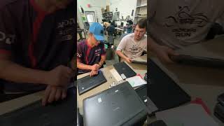 A Whole Table of Laptops Came In. The Tech For Troops Team Got to Work.