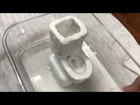 Tyler’s miniature flushing clay toilet