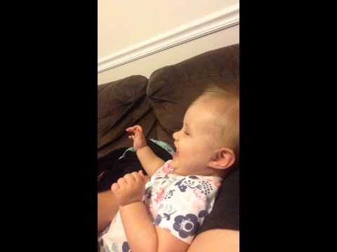 Cute baby giggling joyfully!  Mom is so funny!