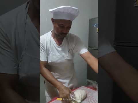 Slicing of dought to its same sizes and same weights of about 50 grams to make empanadas.