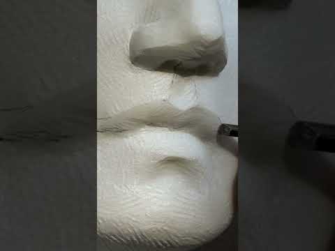 Carving a mouth in marble