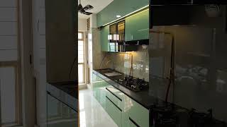 sage green acrylic modular kitchen design