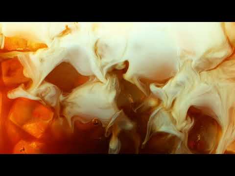 Tejano Craft Coffee - Super slow motion pouring milk into coffee
