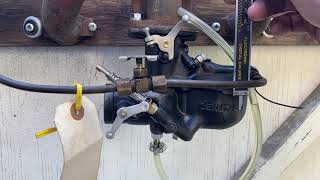 Checking the float level on the Model A carburetor.