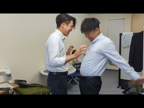 It's lunchtime, so whoever loses the hand-pushing sumo match will cook the meal.