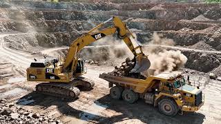 Open Pit Mining in 4K: Excavators Loading Heavy-Duty Dump Trucks.