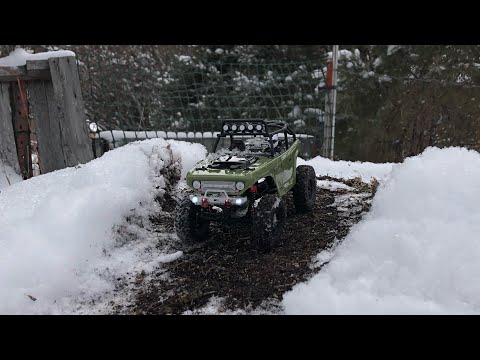 Axial scx24 deadbolt on snow covered dirt track
